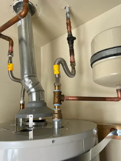 Water heater installation and plumbing repair in Club